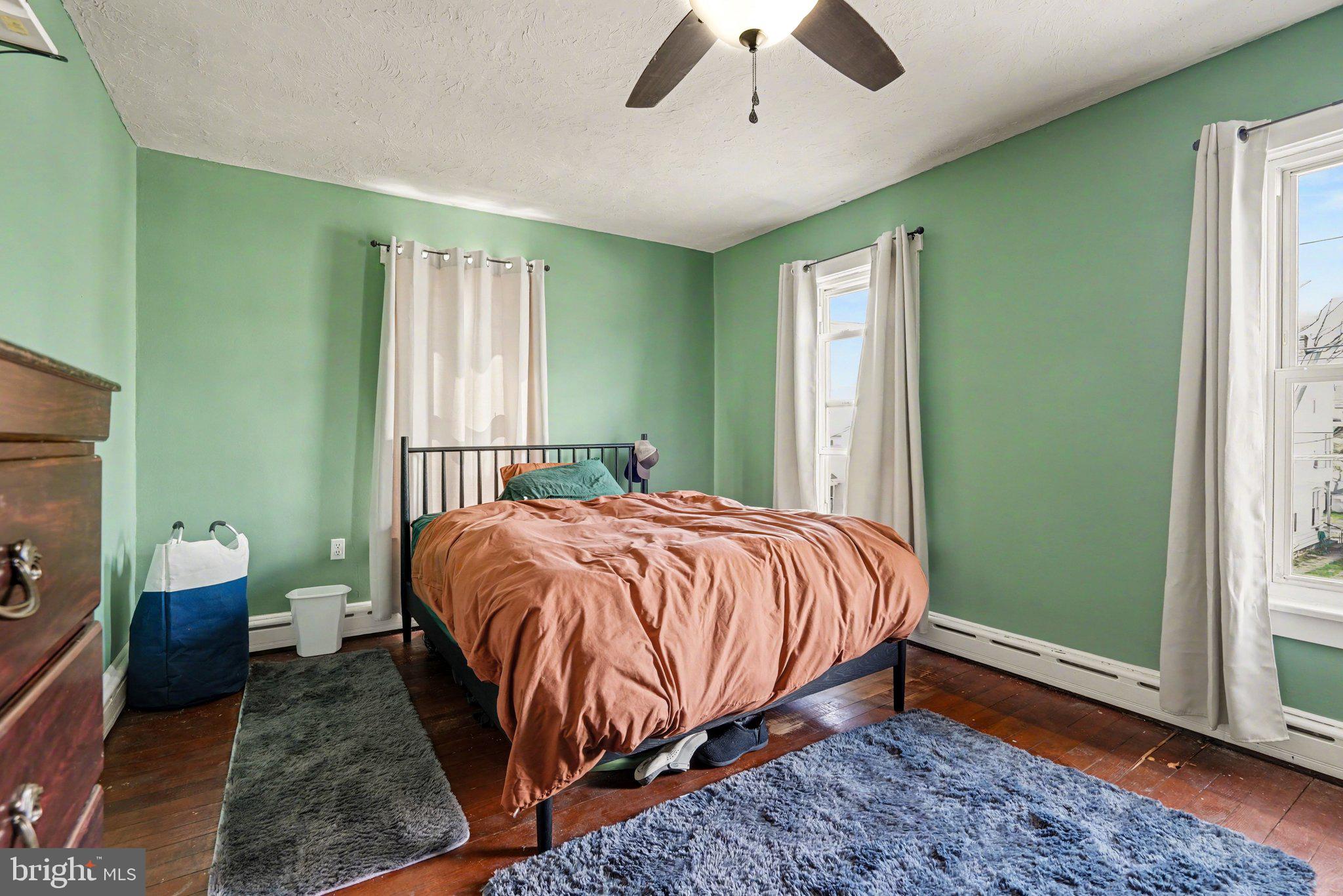 116 West Broad Street Elizabethville, PA 17023 - Photo 12 of 28 a bed sitting in a spacious bedroom next to a window