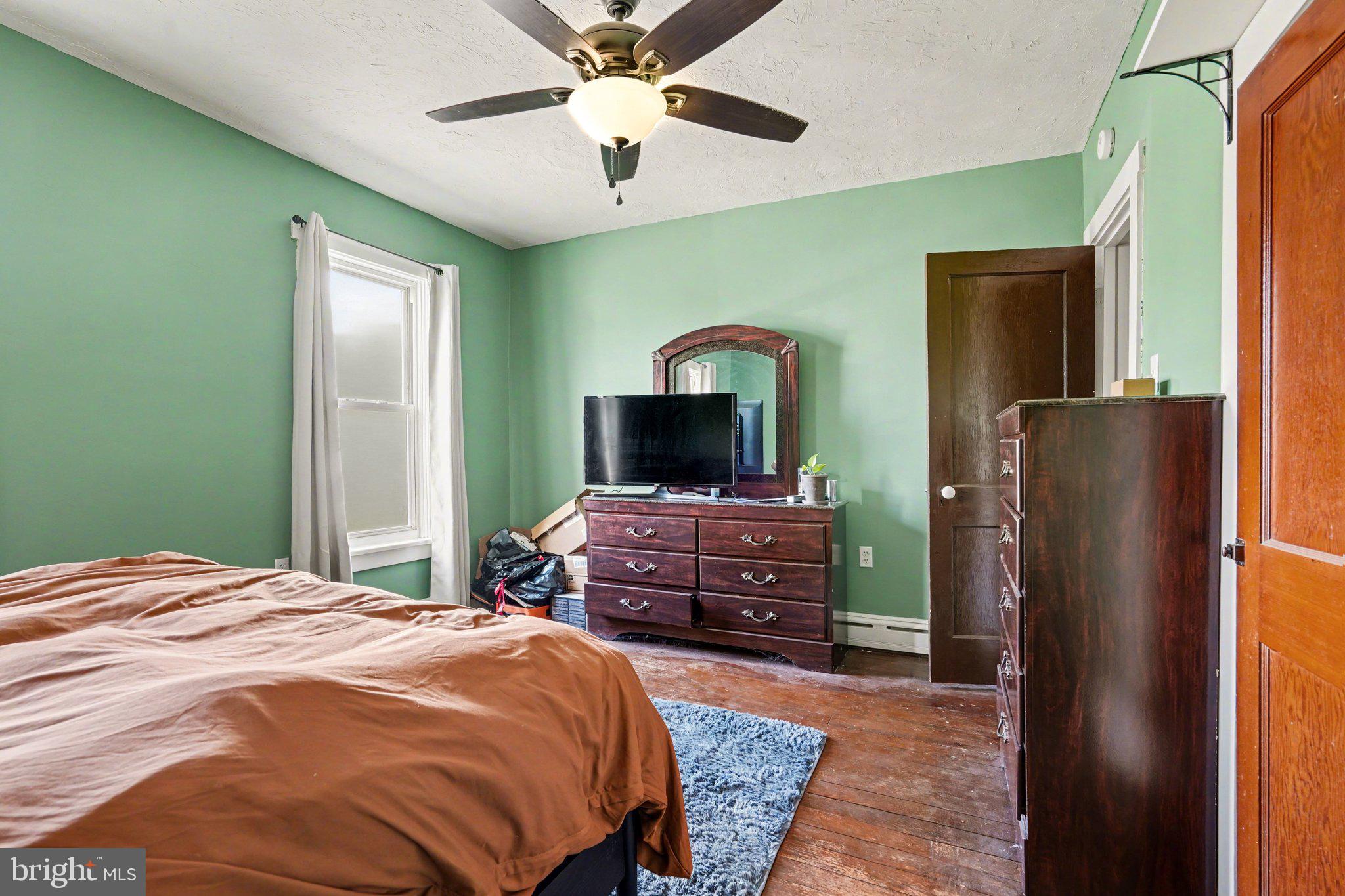 116 West Broad Street Elizabethville, PA 17023 - Photo 13 of 28 a bedroom with a bed and a dresser
