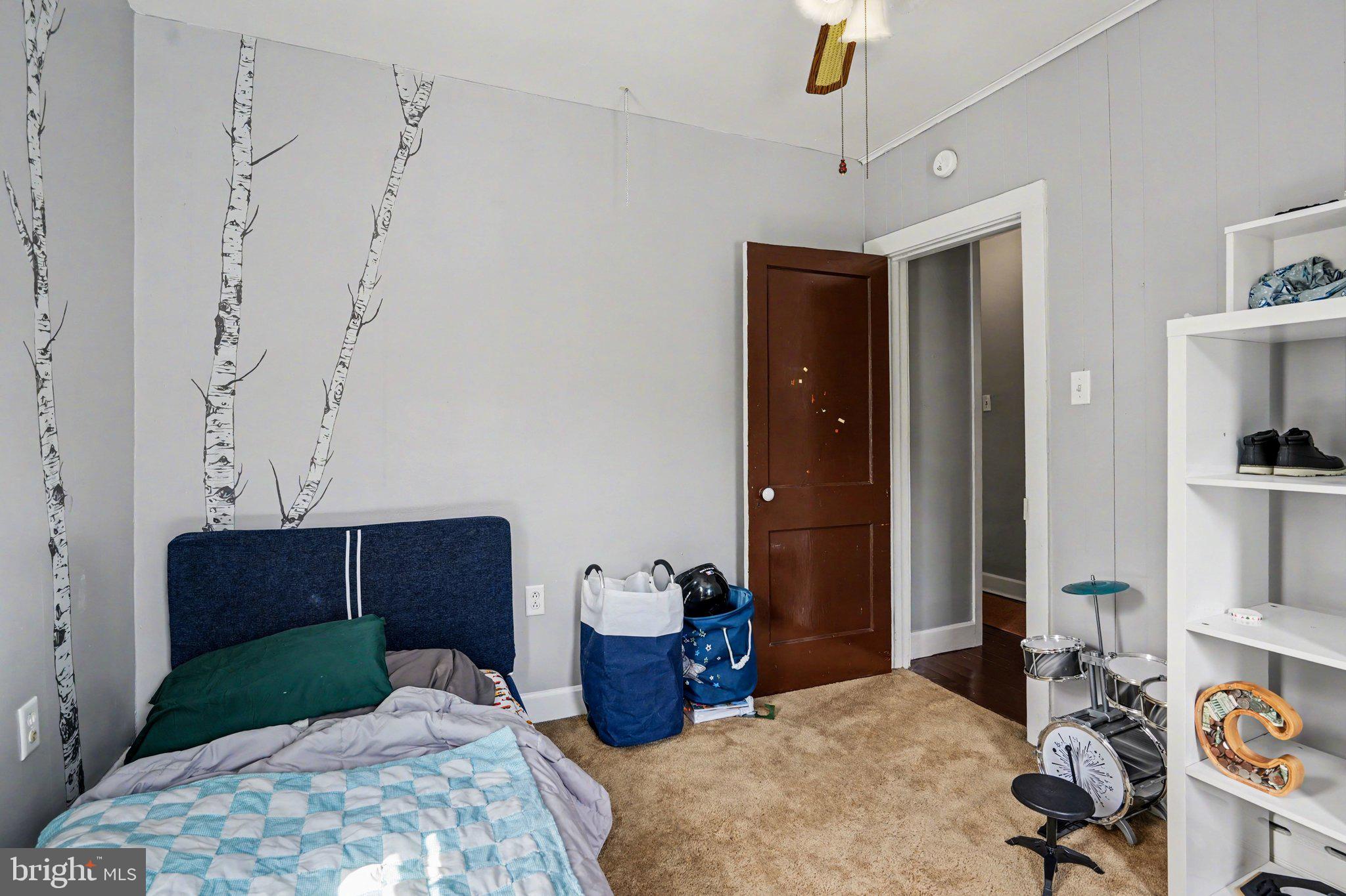 116 West Broad Street Elizabethville, PA 17023 - Photo 16 of 28 a bedroom with a bed and a chandelier