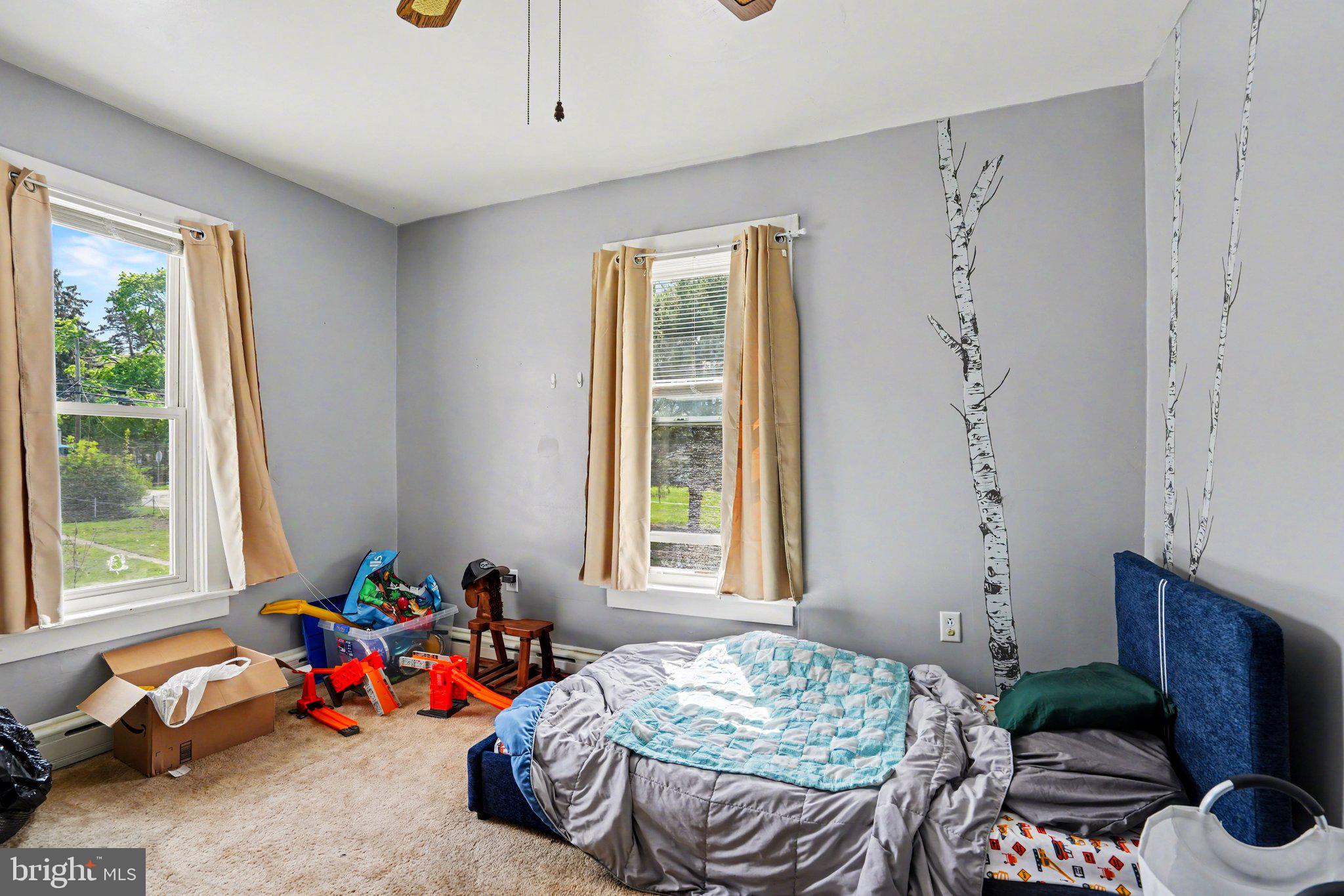 116 West Broad Street Elizabethville, PA 17023 - Photo 17 of 28 a bedroom with a bed and wooden floor