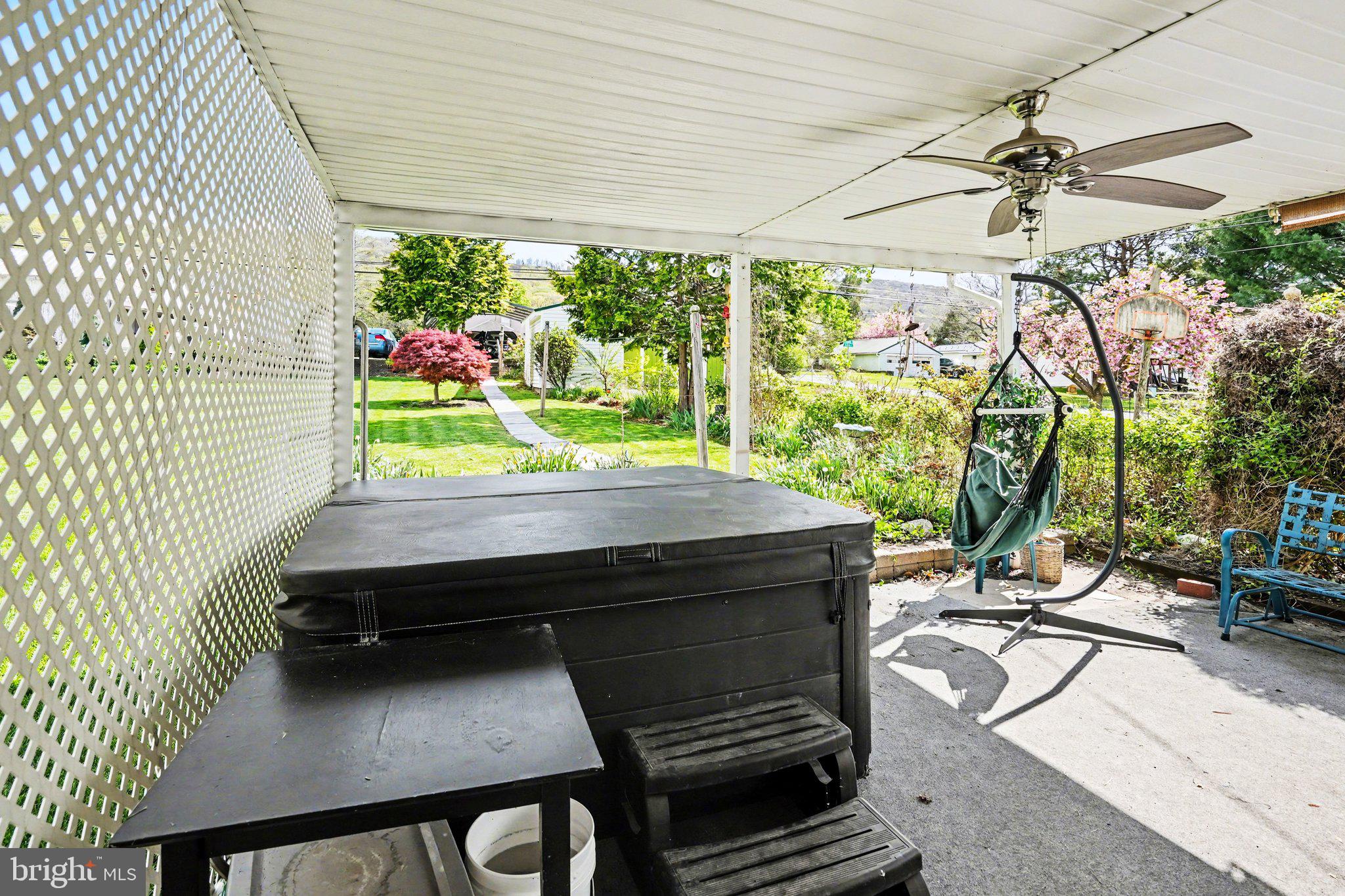 116 West Broad Street Elizabethville, PA 17023 - Photo 21 of 28 a view of a patio with table and chairs potted plants with wooden floor