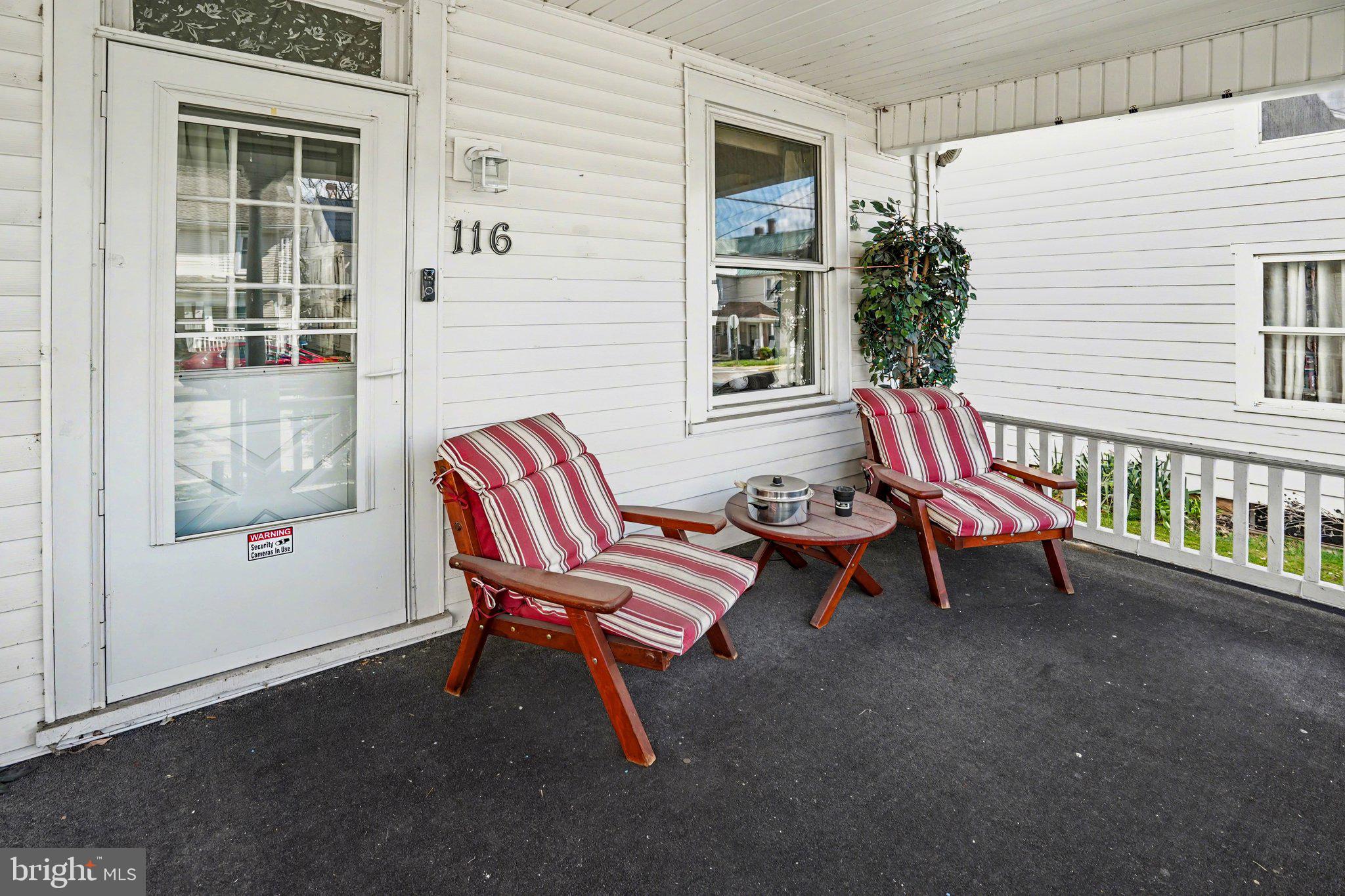 116 West Broad Street Elizabethville, PA 17023 - Photo 3 of 28 a wooden bench sitting in front of a house
