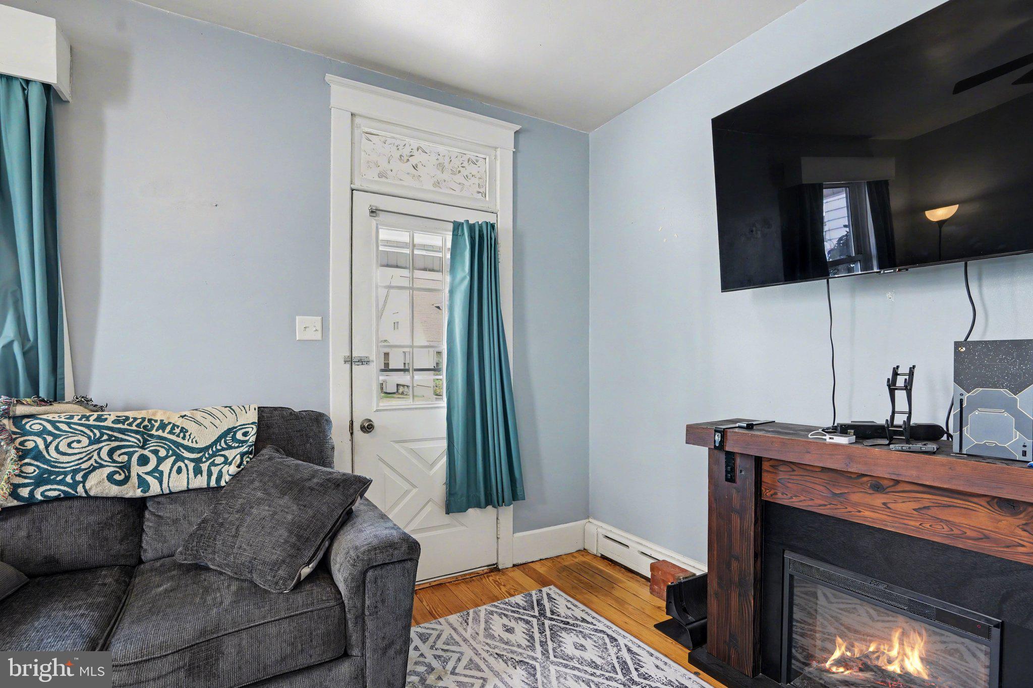 116 West Broad Street Elizabethville, PA 17023 - Photo 6 of 28 a living room with furniture and a fireplace