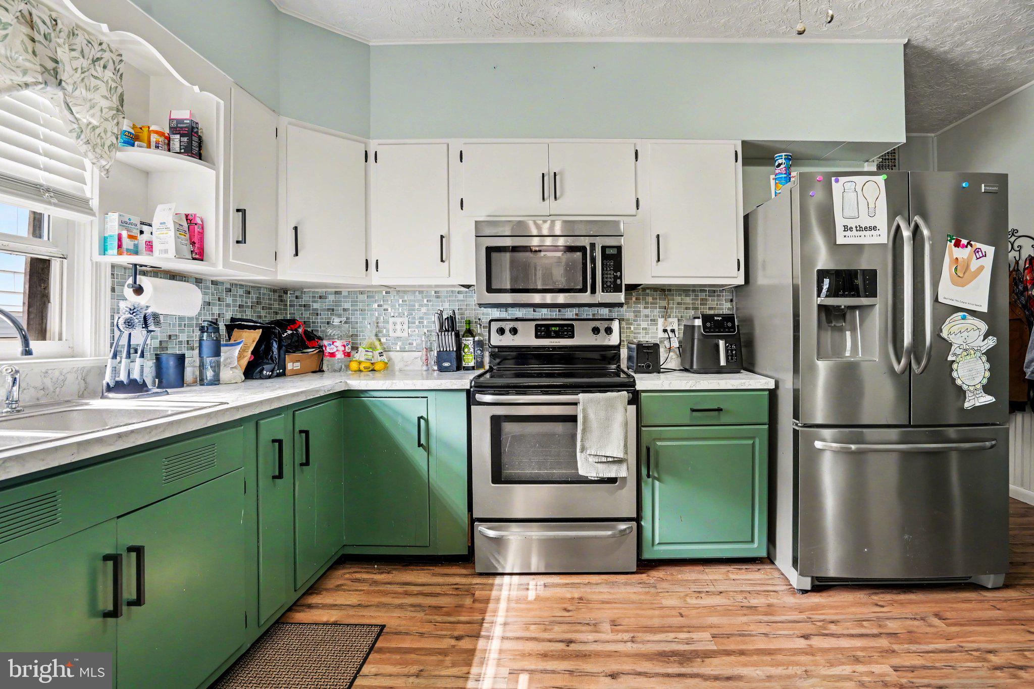 116 West Broad Street Elizabethville, PA 17023 - Photo 8 of 28 a kitchen with a refrigerator and a sink