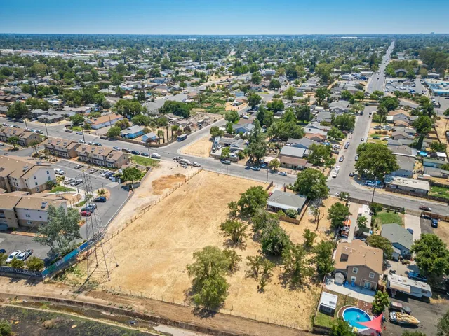 an aerial view of residential houses with outdoor space