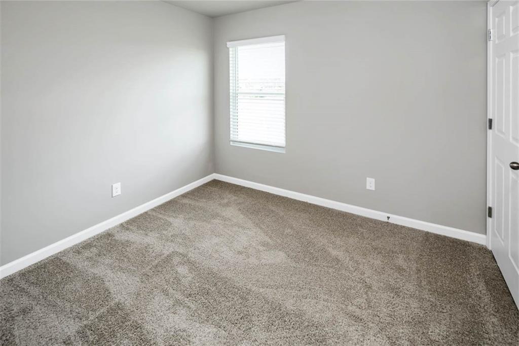 205 Lauritsen Way Newnan, GA 30265 - Photo 12 of 22 an empty room with a window