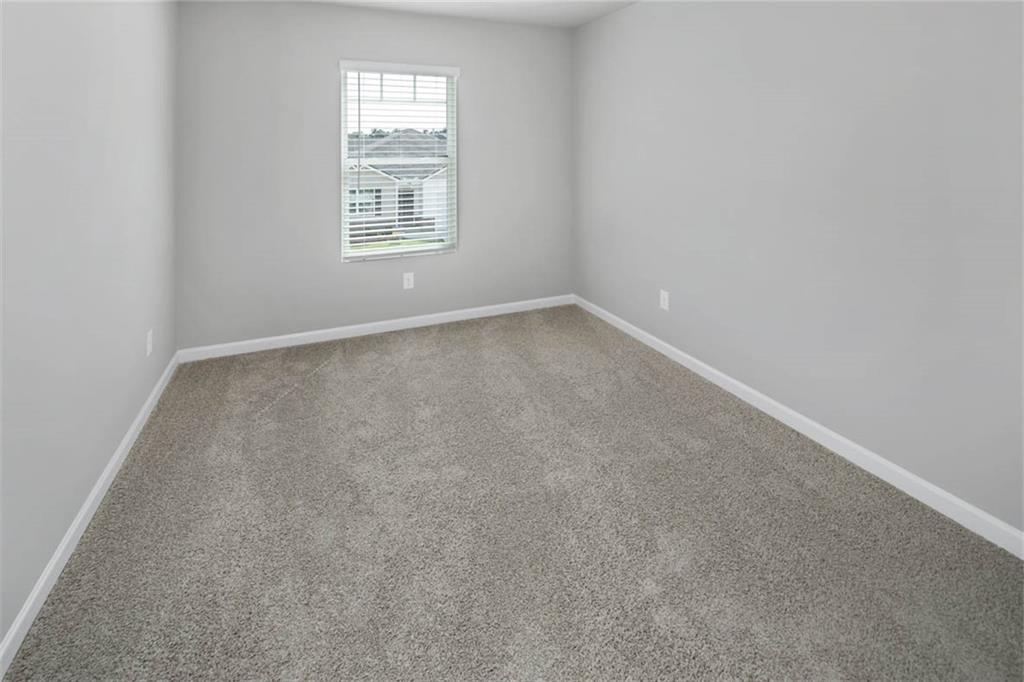 205 Lauritsen Way Newnan, GA 30265 - Photo 14 of 22 an empty room with a window