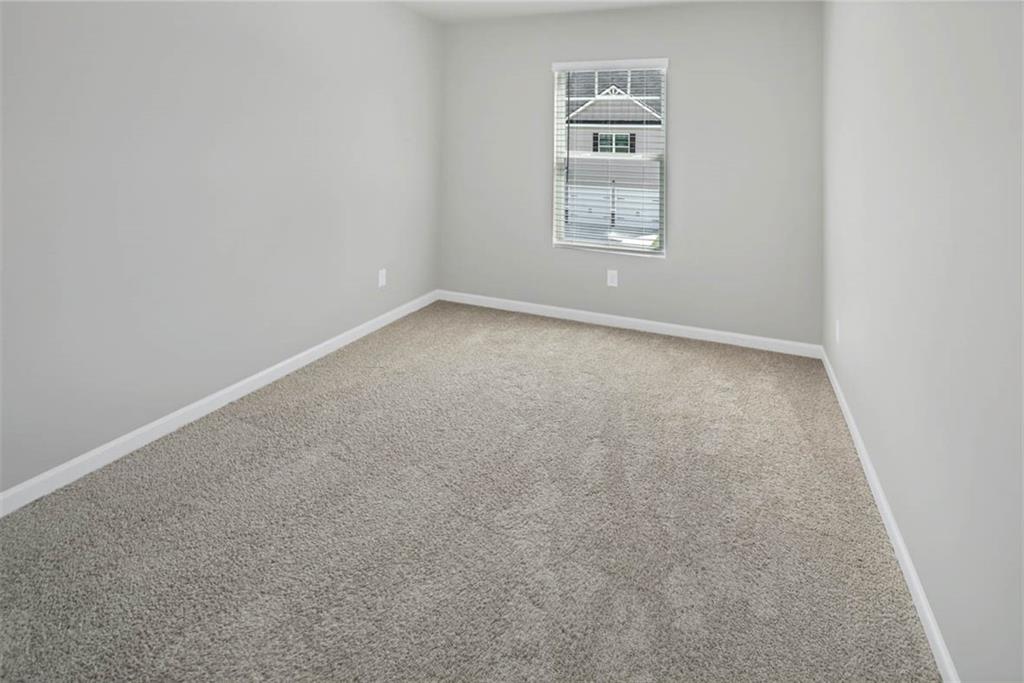 205 Lauritsen Way Newnan, GA 30265 - Photo 17 of 22 an empty room with windows