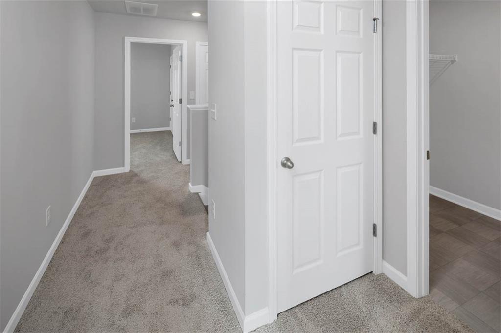 205 Lauritsen Way Newnan, GA 30265 - Photo 19 of 22 an empty room with a hallway