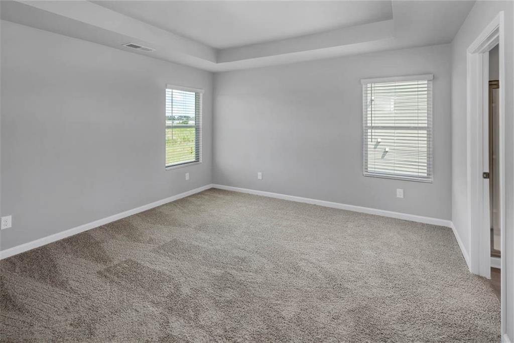 205 Lauritsen Way Newnan, GA 30265 - Photo 4 of 22 an empty room with windows