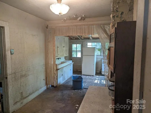 a view of a hallway with wooden shelves