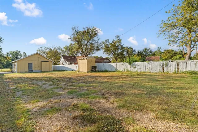a view of a lake with a yard
