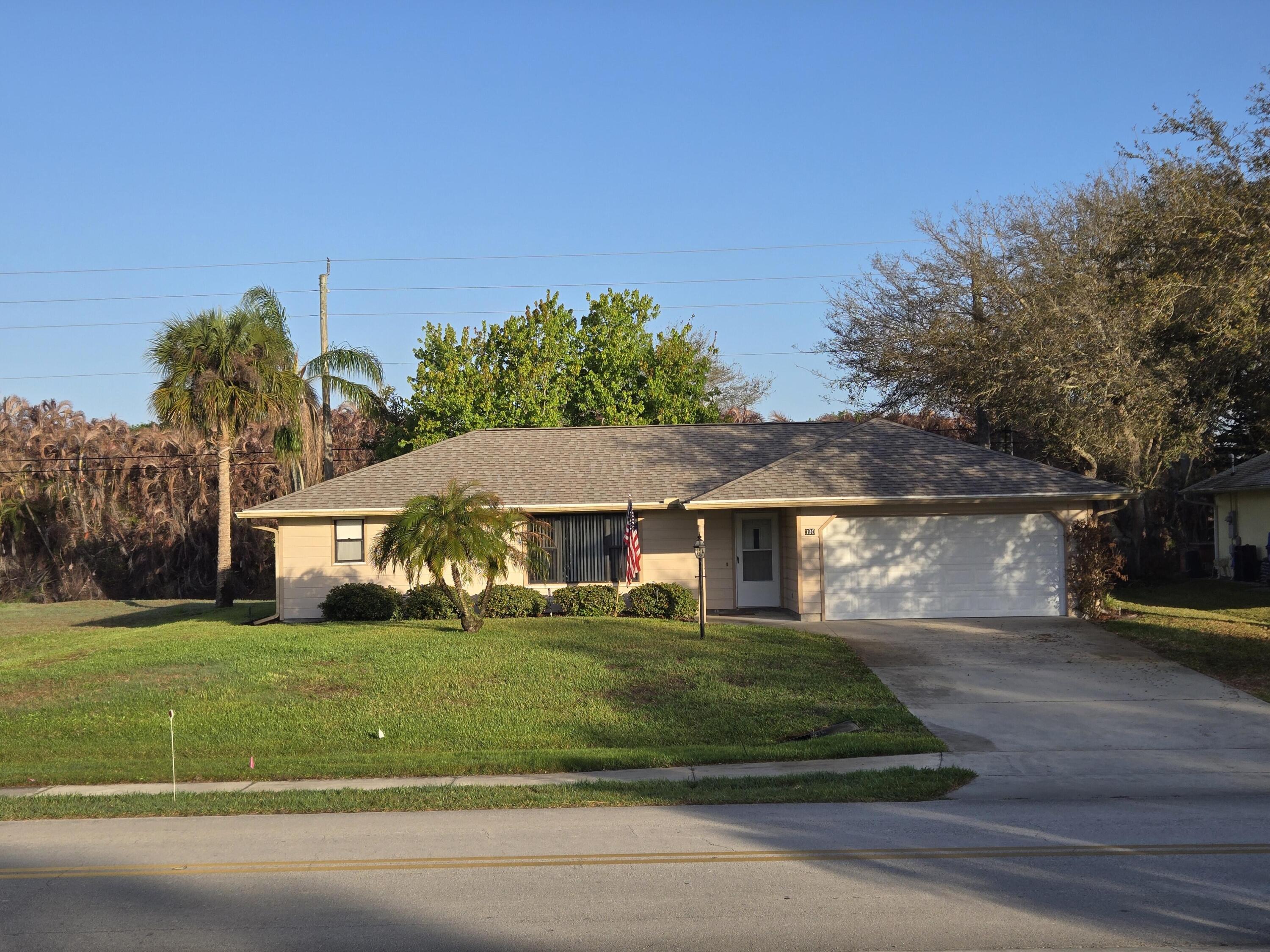 390 Main Street Sebastian, FL 32958 - Photo 1 of 18 a front view of a house with a yard