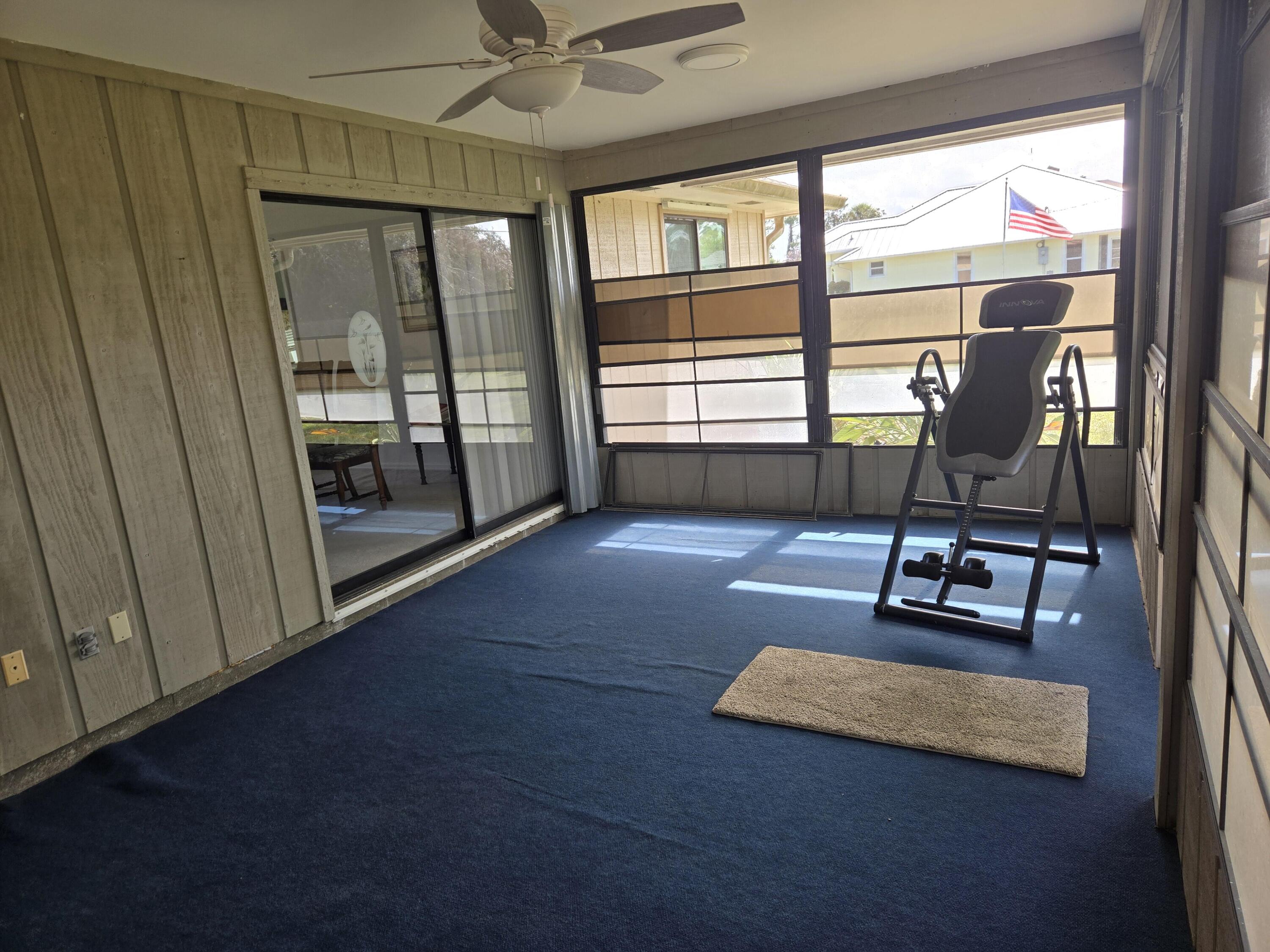 390 Main Street Sebastian, FL 32958 - Photo 16 of 18 a room with gym equipment and a large window