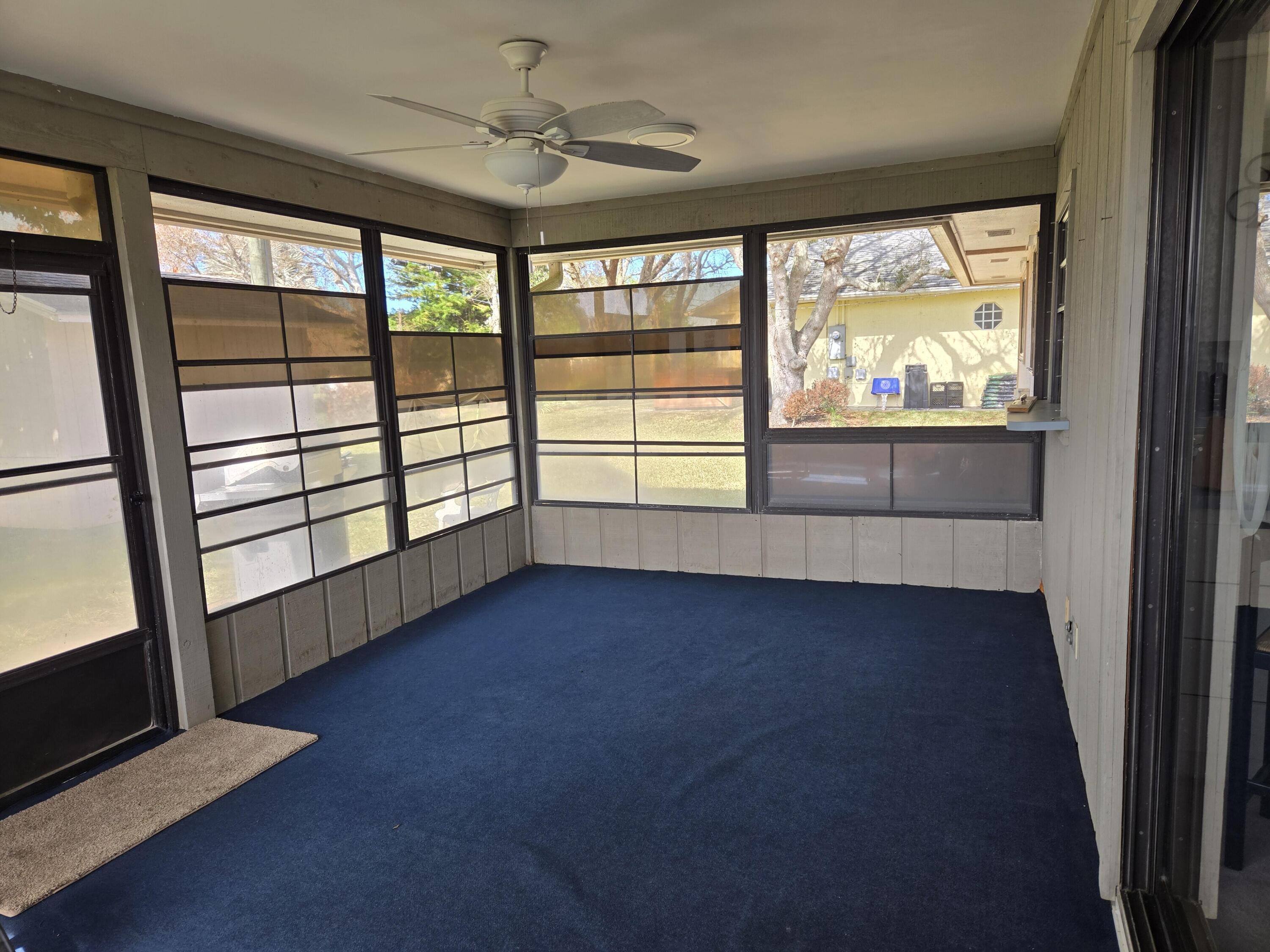 390 Main Street Sebastian, FL 32958 - Photo 17 of 18 an empty room with wooden floor and windows