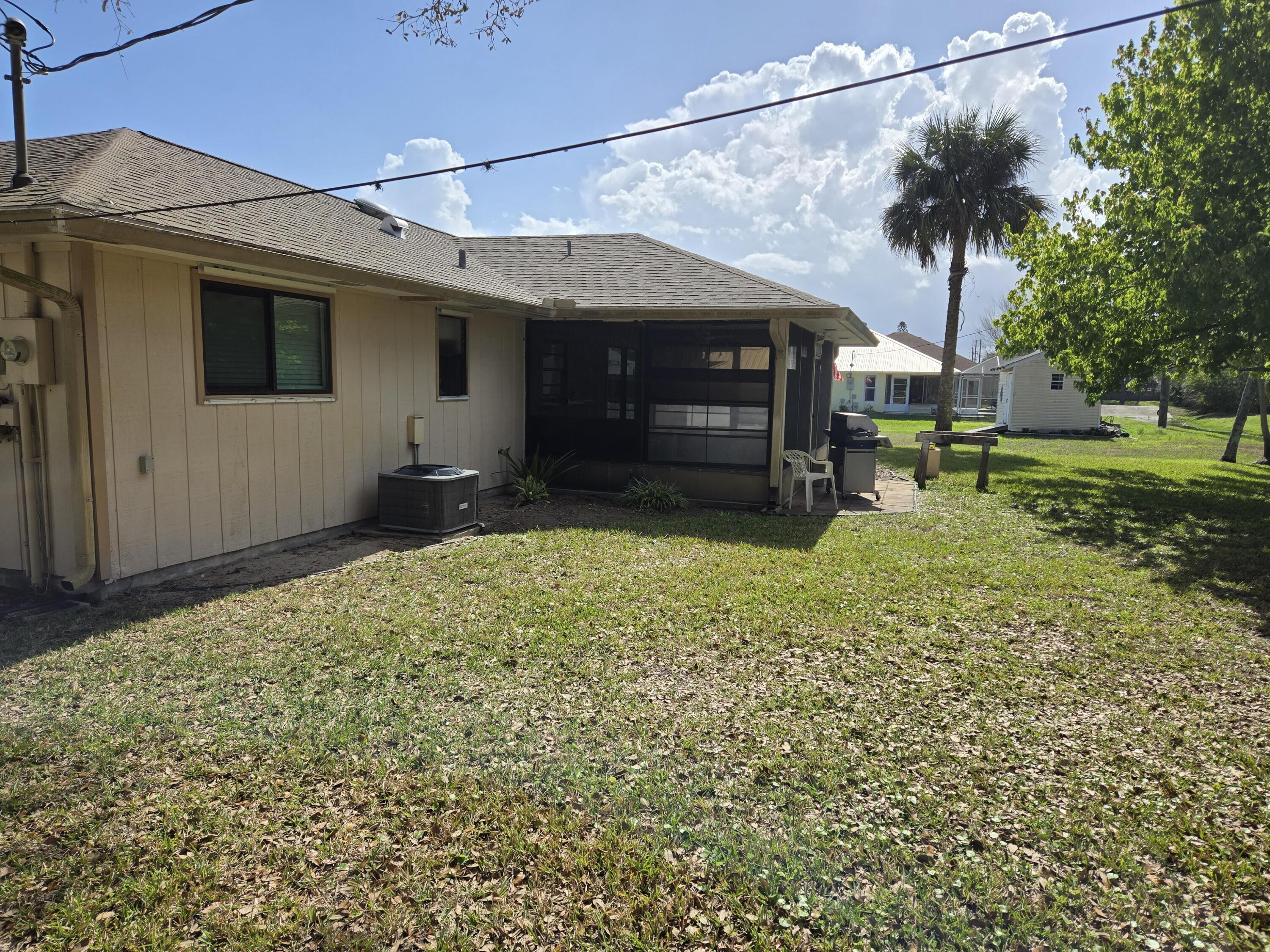 390 Main Street Sebastian, FL 32958 - Photo 3 of 18 a view of a house with a yard and sitting area