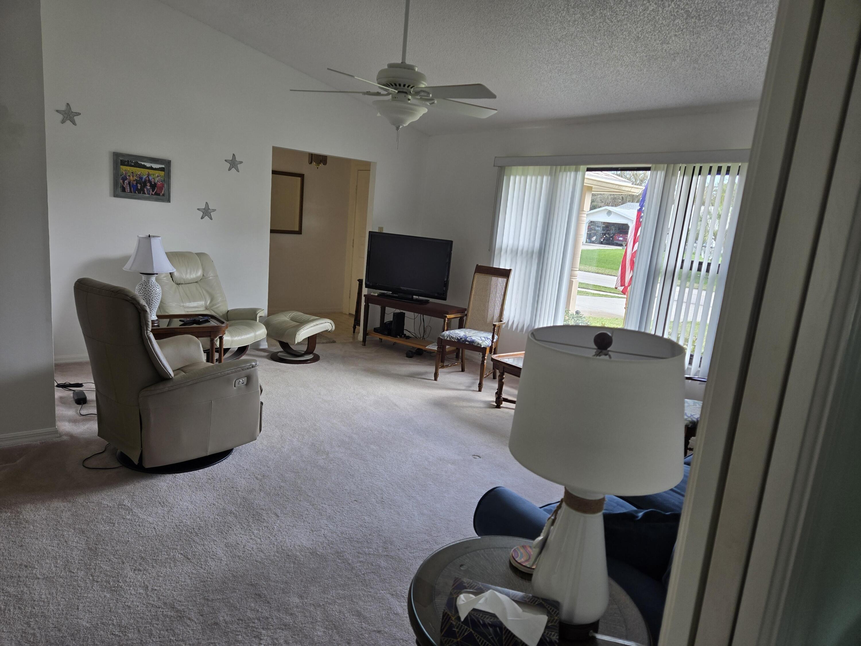 390 Main Street Sebastian, FL 32958 - Photo 6 of 18 a living room with furniture and a large window