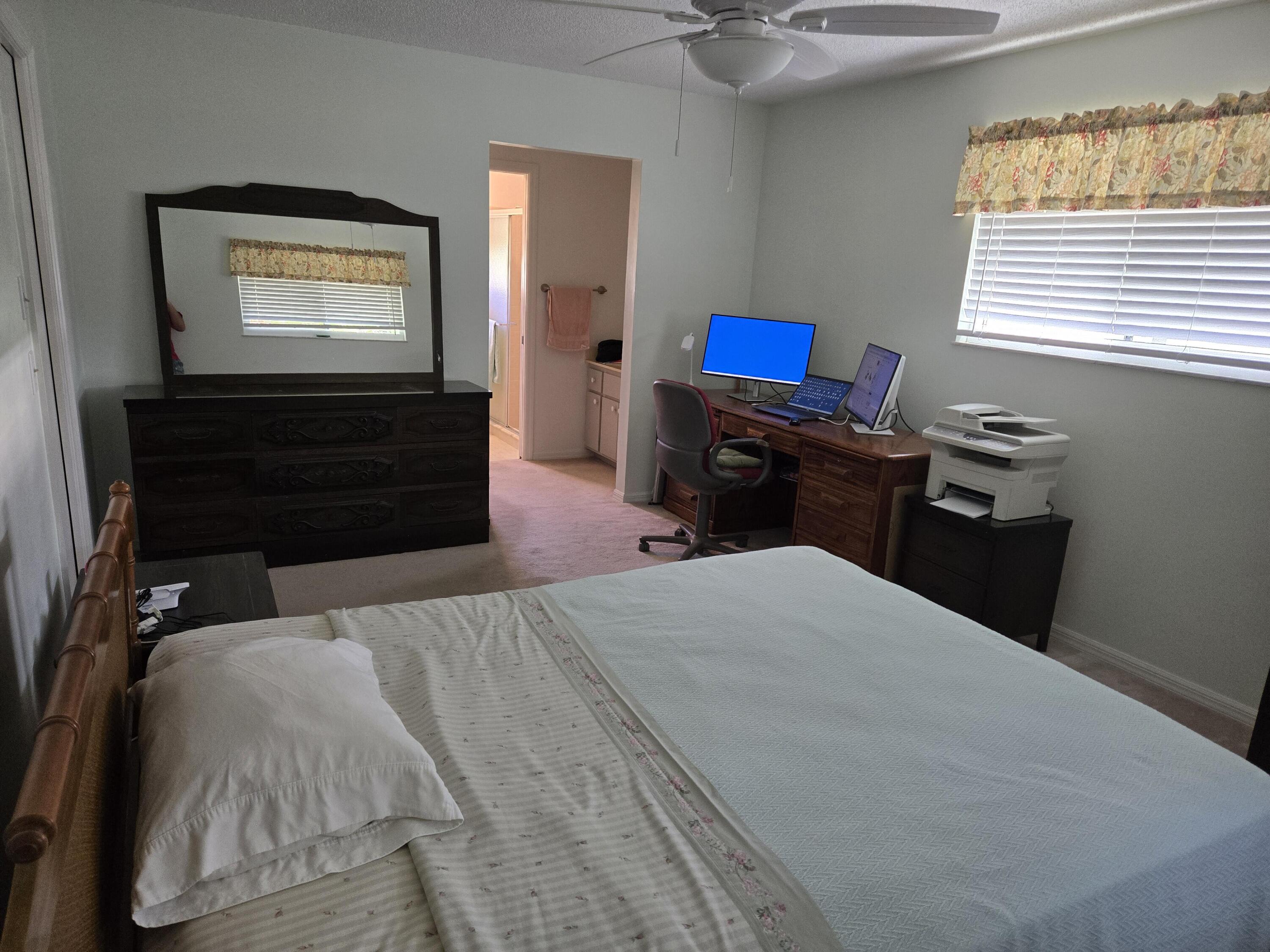 390 Main Street Sebastian, FL 32958 - Photo 8 of 18 a bedroom with a bed and a television