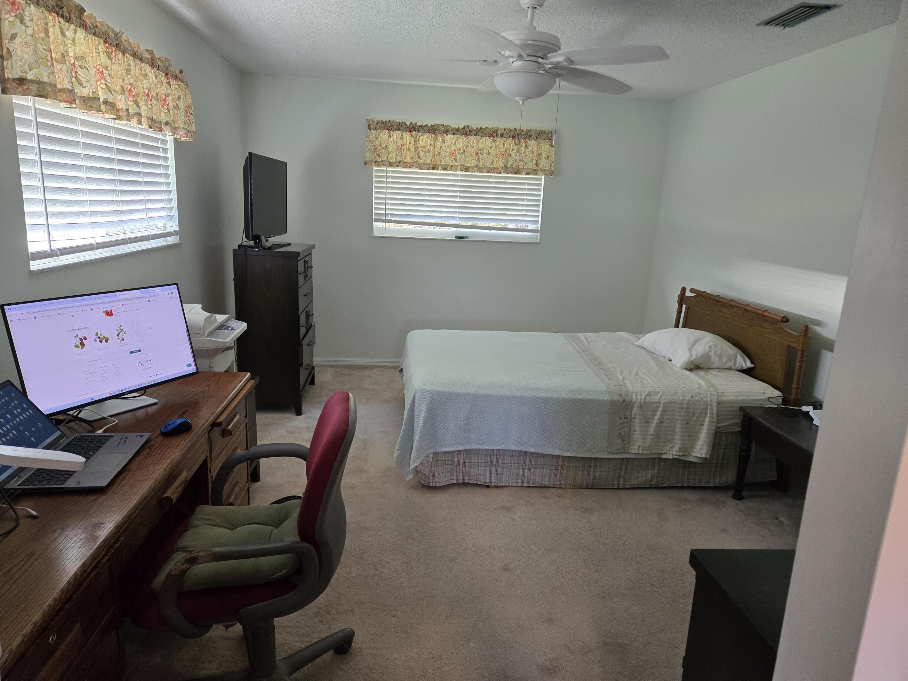 390 Main Street Sebastian, FL 32958 - Photo 9 of 18 a bedroom with furniture and a window
