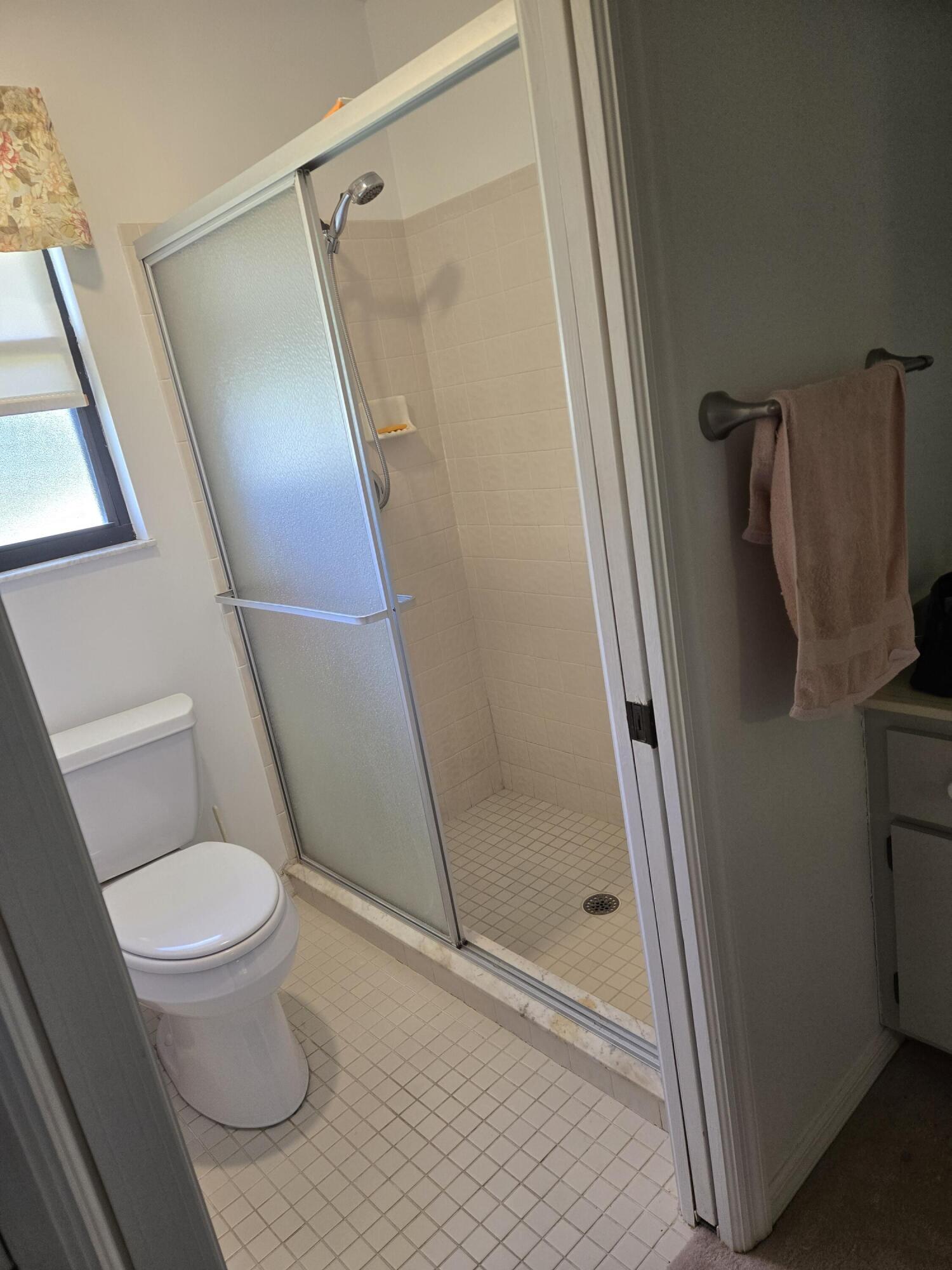 390 Main Street Sebastian, FL 32958 - Photo 10 of 18 a bathroom with a toilet and a shower