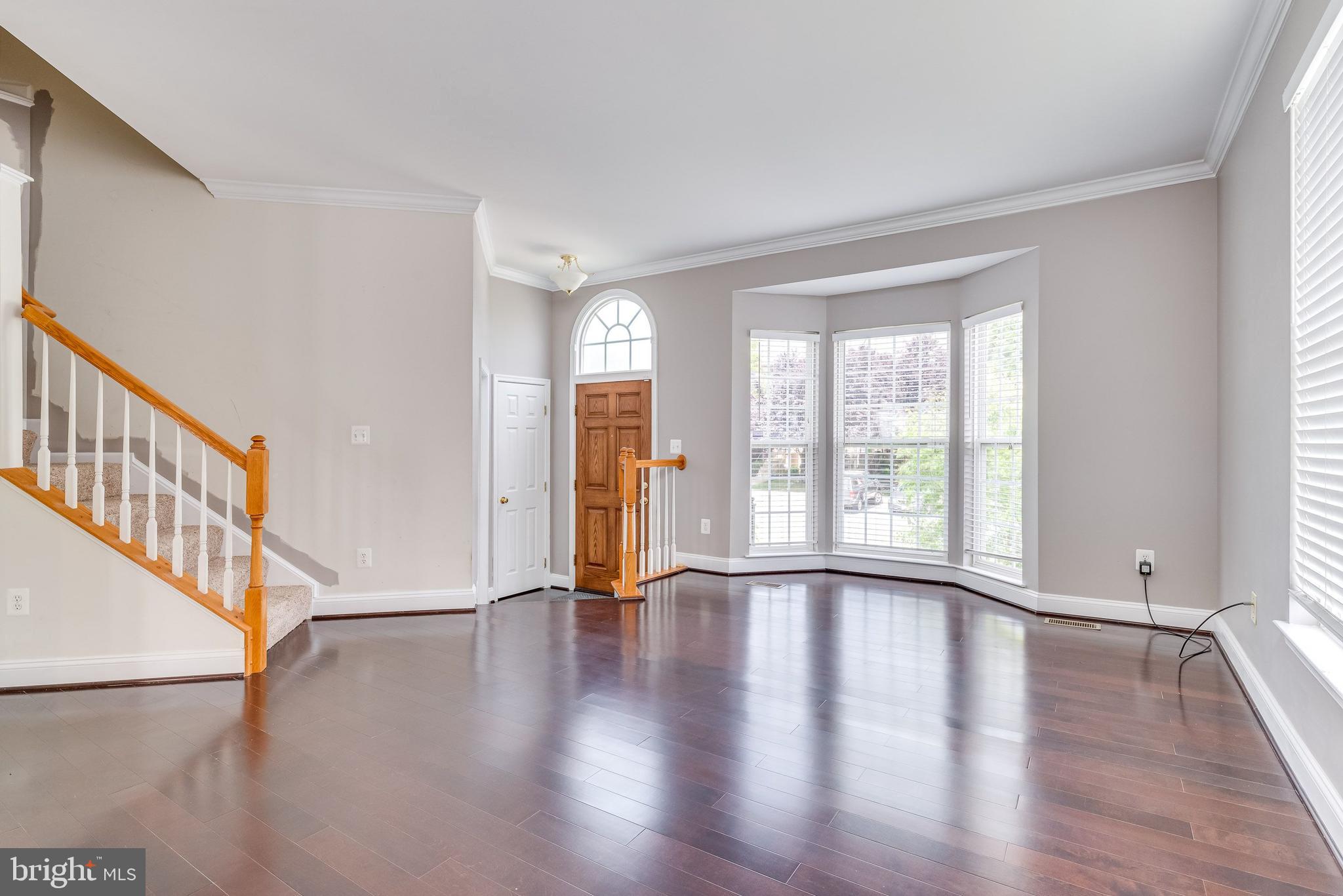 156 Riparian Lane Ranson, WV 25438 - Photo 6 of 39 Living Room with Bay Window and laminate flooring