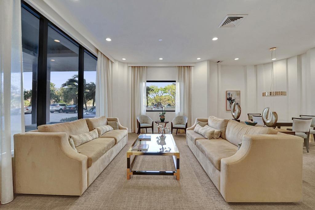 2000 South Ocean Boulevard, Unit 4C Lauderdale-by-the-Sea, FL 33062 - Photo 34 of 49 a living room with furniture and a large window