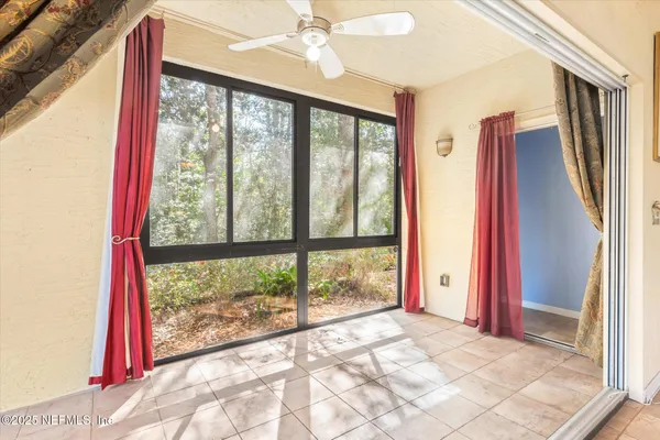 a view of a room with a large window