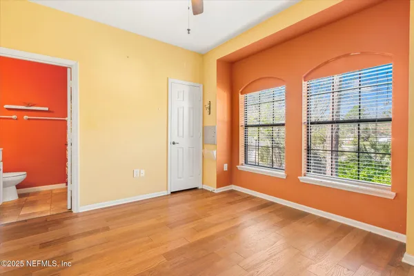 a view of an empty room with glass door