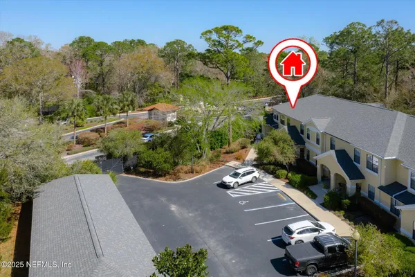 a view of a two chairs in the patio