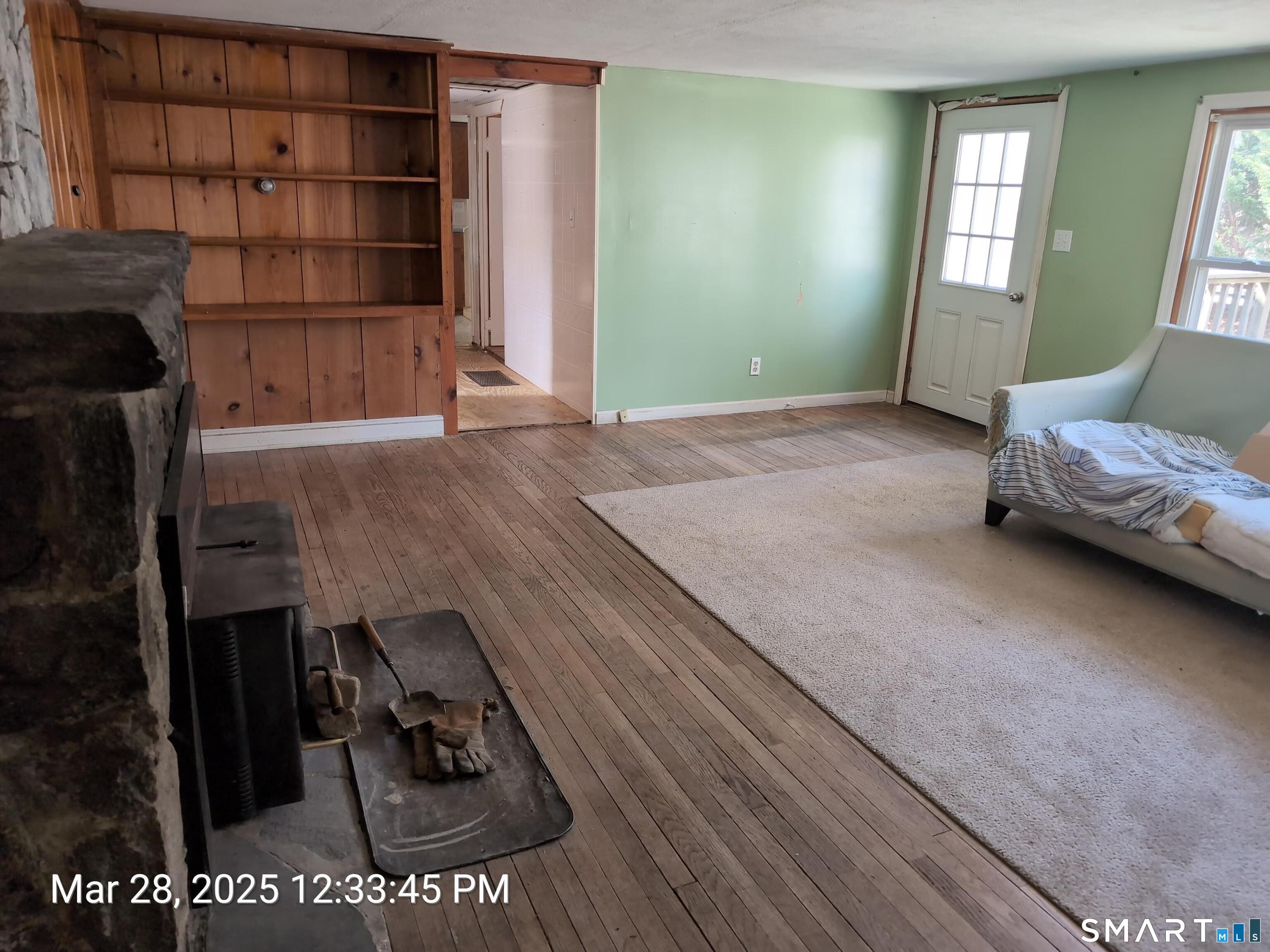 97 Bushy Hill Road Deep River, CT 06417 - Photo 19 of 28 a living room with a couch and a walk in closet