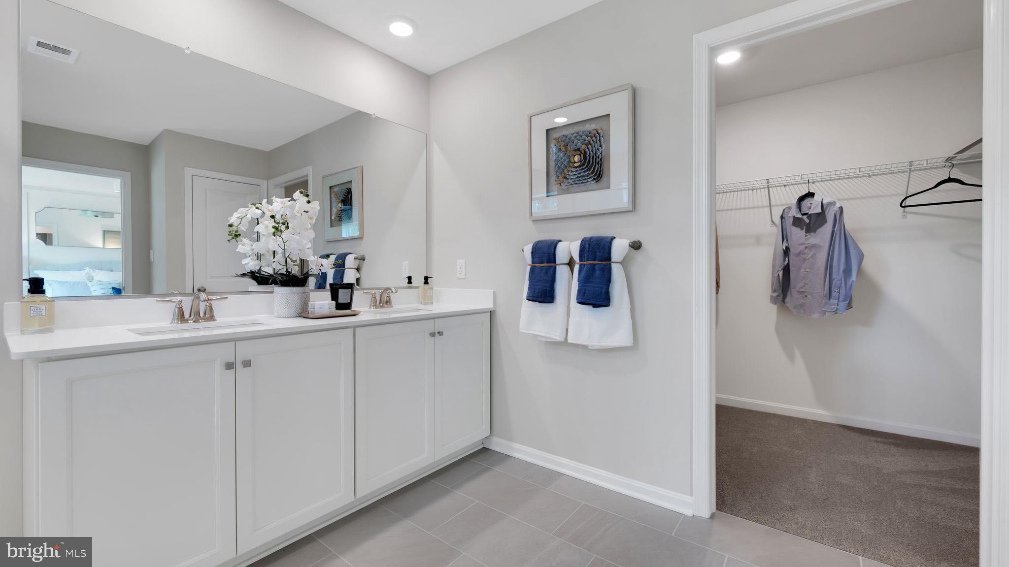 109 Pear Rdg Drive Harrisburg, PA 17111 - Photo 17 of 28 a bathroom with a double vanity sink a mirror and shower