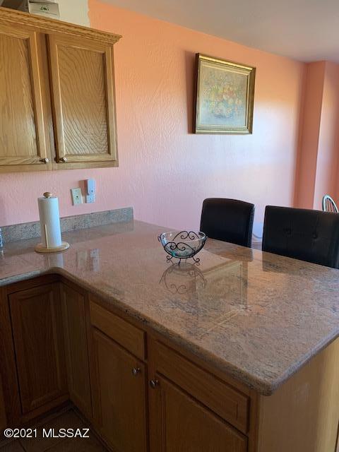 3504 East Howling Wolf Road Willcox, AZ 85643 - Photo 11 of 21 a kitchen with a sink and cabinets