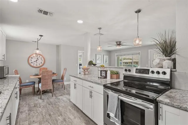 a kitchen with a stove and a table