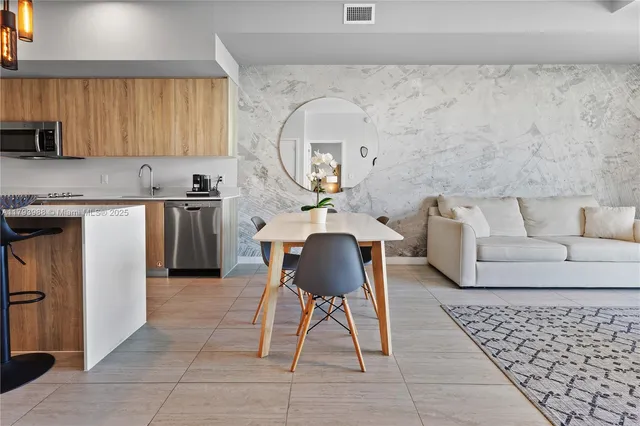 a living room with furniture and a rug