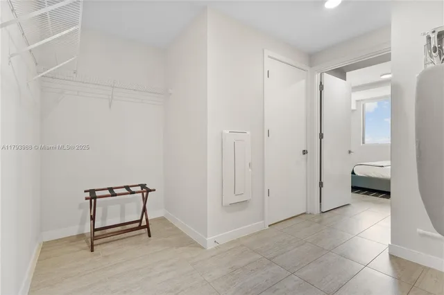 a view of a room with a furniture and a window