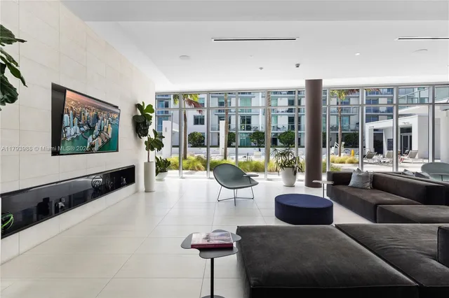 a living room with furniture large window and flat screen tv