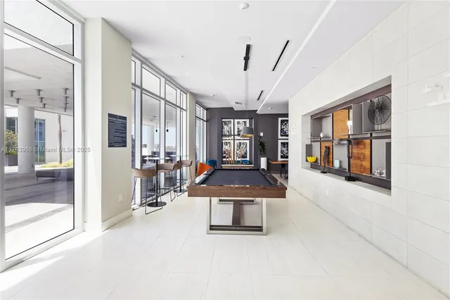 a room with lots of table and chairs