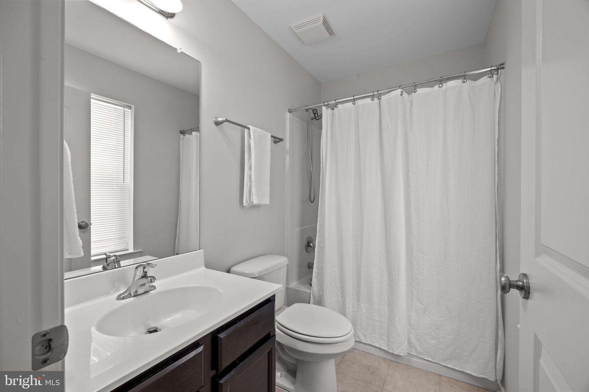 3669 Jacob Stout Road, Unit 9 Doylestown, PA 18902 - Photo 21 of 36 a bathroom with a sink toilet and shower