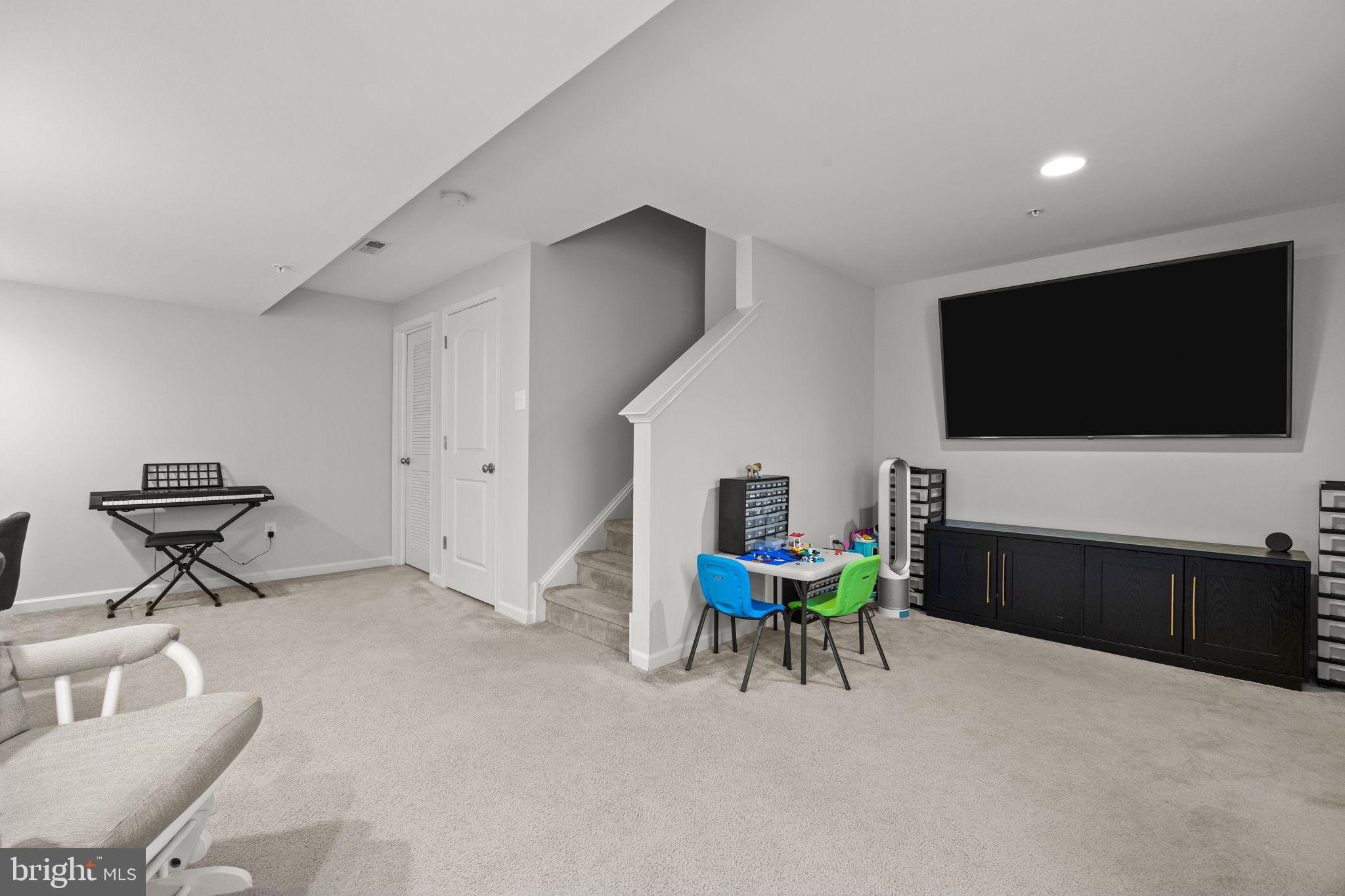 3669 Jacob Stout Road, Unit 9 Doylestown, PA 18902 - Photo 26 of 36 a living room with furniture and a flat screen tv