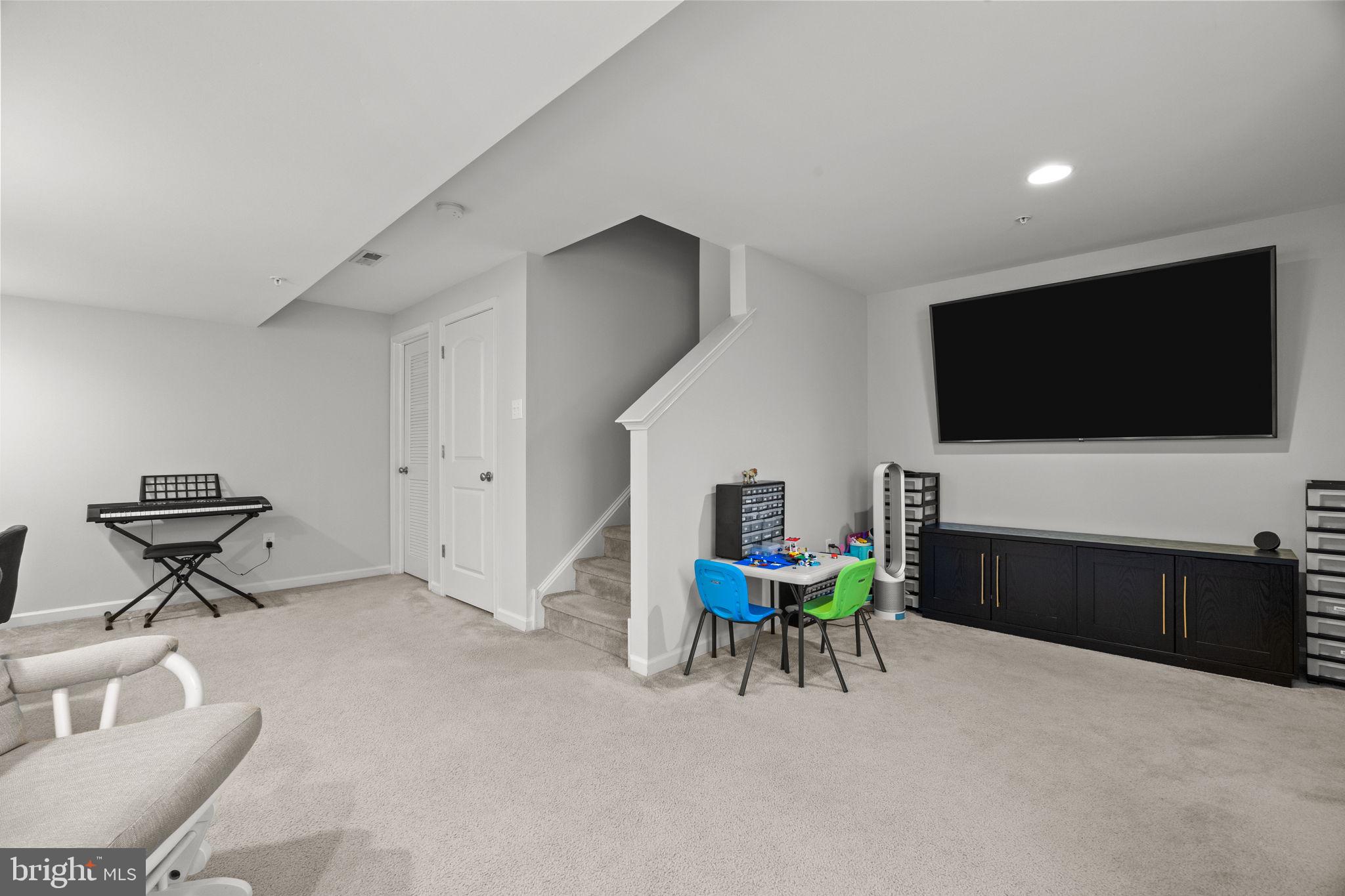 3669 Jacob Stout Road, Unit 9 Doylestown, PA 18902 - Photo 27 of 36 a living room with furniture and a flat screen tv