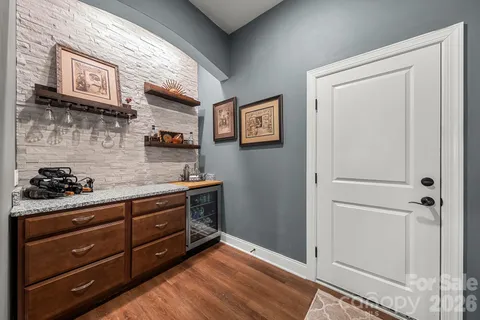 a kitchen with a cabinets and wooden floor