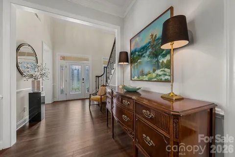 a living room with furniture and a mirror