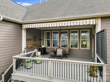 a view of a house with a large window and wooden floor
