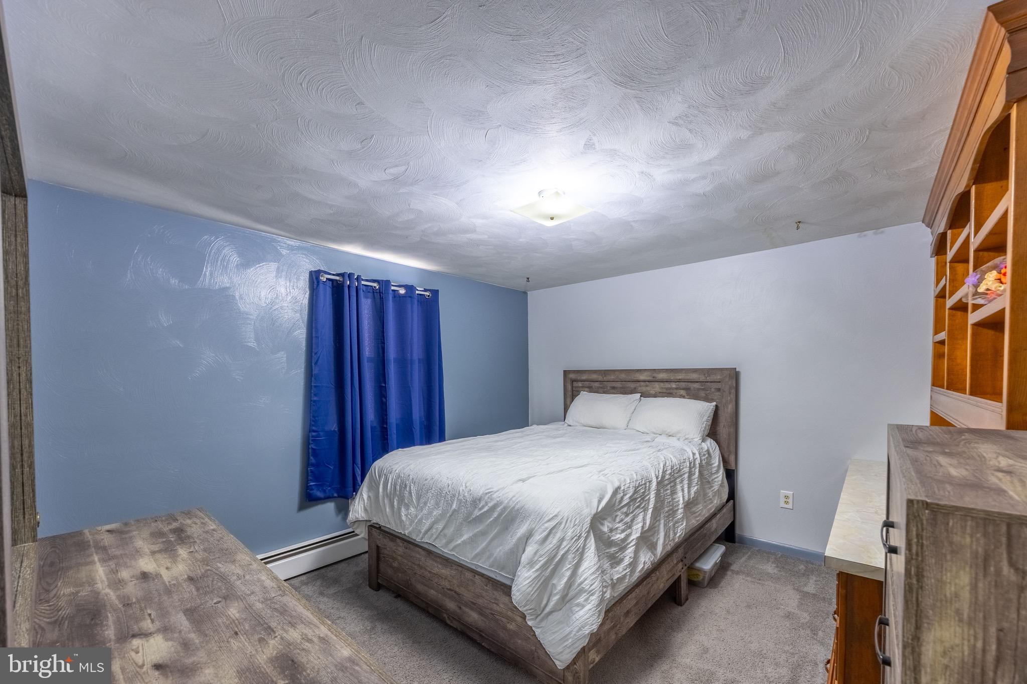 110 South Blettner Avenue Hanover, PA 17331 - Photo 15 of 30 a bedroom with a bed and a night stand