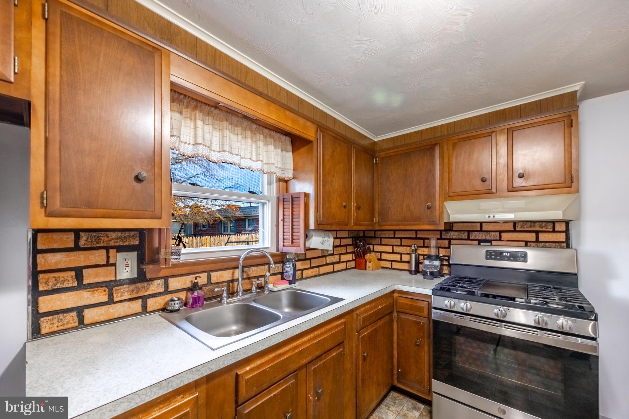 110 South Blettner Avenue Hanover, PA 17331 - Photo 7 of 30 a kitchen with a sink stove top oven and cabinets