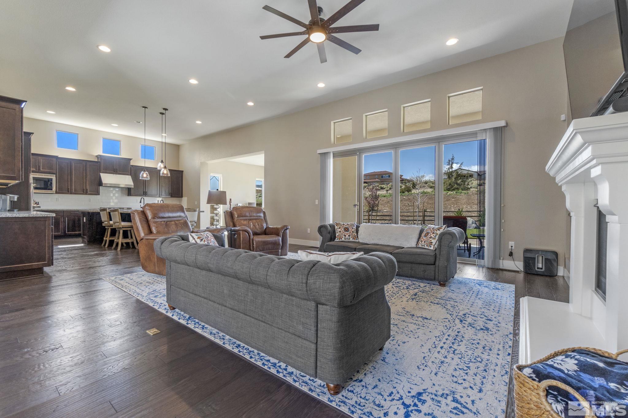 13357 Travertine Lane Reno, NV 89511 - Photo 12 of 39 a living room with furniture and a large window
