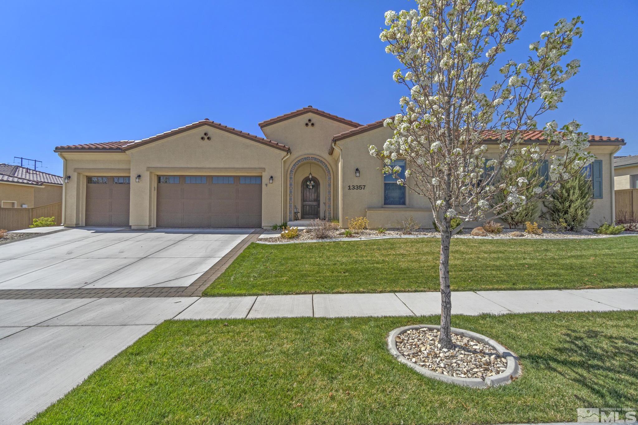 13357 Travertine Lane Reno, NV 89511 - Photo 2 of 39 a front view of a house with a yard