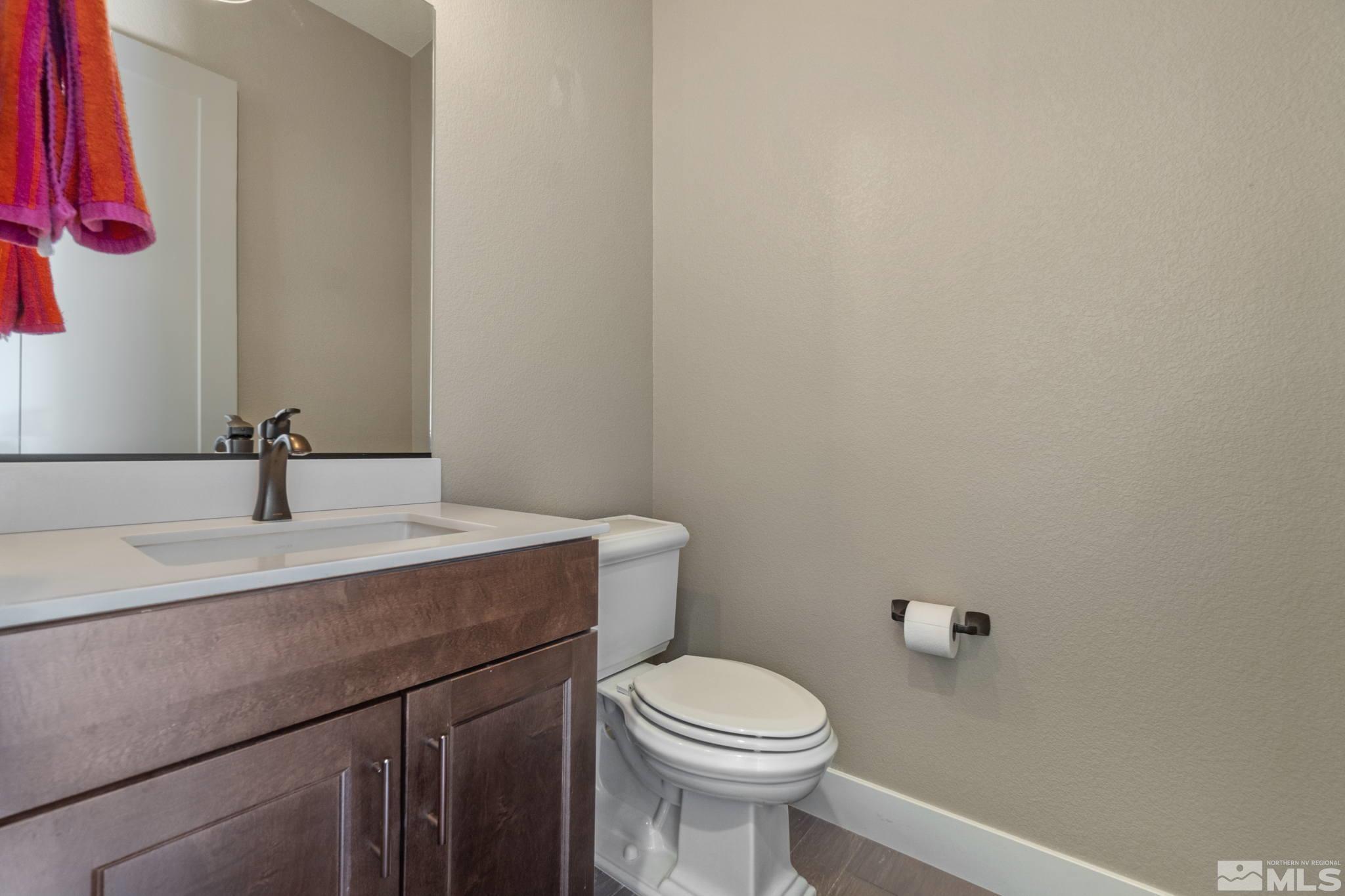 13357 Travertine Lane Reno, NV 89511 - Photo 22 of 39 a bathroom with a sink and a toilet