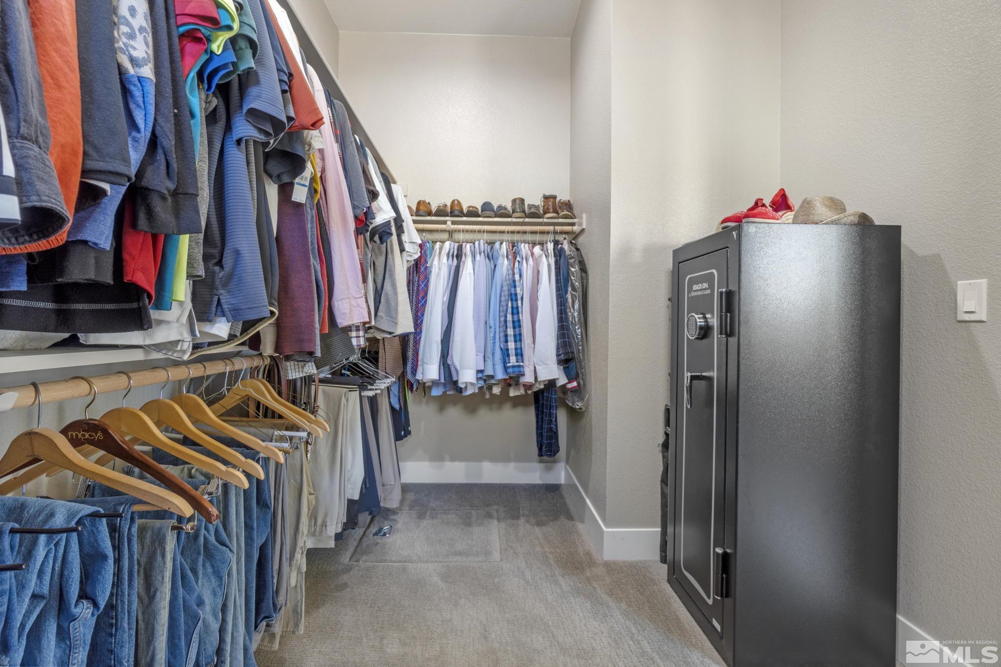 13357 Travertine Lane Reno, NV 89511 - Photo 29 of 39 a view of walk in closet with clothes