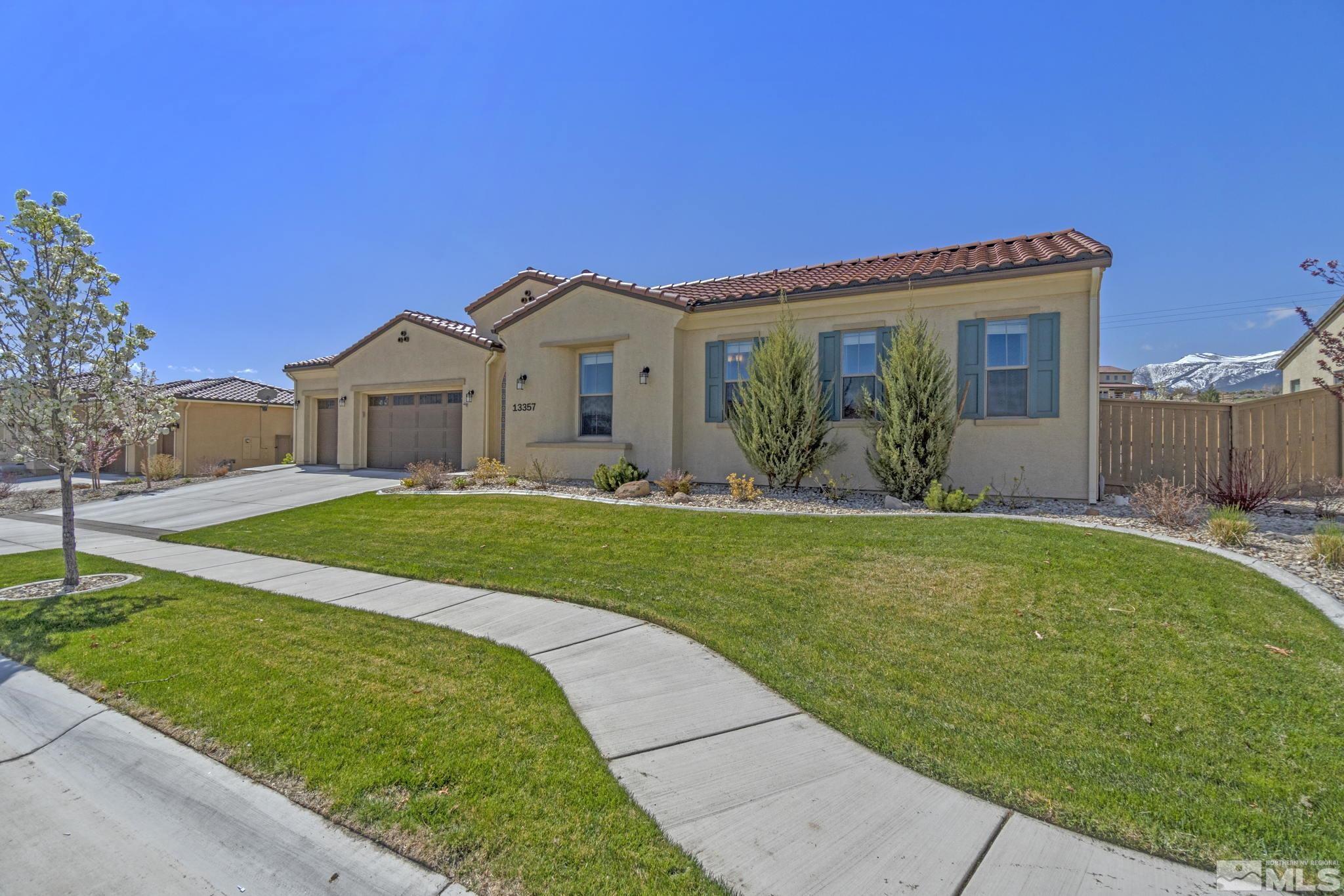 13357 Travertine Lane Reno, NV 89511 - Photo 3 of 39 a front view of a house with garden